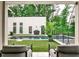 Stunning backyard oasis with a modern pool, lush landscaping, and an outdoor entertaining area at 1572 Clifton Rdg, Atlanta, GA 30307