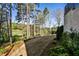Serene backyard view overlooking lush greenery and the golf course, enhanced by a sleek fence at 1572 Clifton Rdg, Atlanta, GA 30307