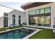 Modern backyard features an inground pool, patio, and chairs at 1572 Clifton Rdg, Atlanta, GA 30307