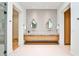 Modern bathroom with double sink vanity, vessel sinks, and stylish round mirrors at 1572 Clifton Rdg, Atlanta, GA 30307