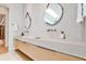 Modern bathroom with double sink vanity, vessel sinks, and stylish round mirrors at 1572 Clifton Rdg, Atlanta, GA 30307