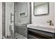 Modern bathroom featuring gray textured tile, a glass shower and a sleek floating vanity at 1572 Clifton Rdg, Atlanta, GA 30307