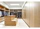 Large walk-in closet featuring custom wood shelving, ample storage, and a skylight for natural light at 1572 Clifton Rdg, Atlanta, GA 30307