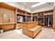Spacious walk-in closet with custom wood shelving and ample storage space for clothes and accessories at 1572 Clifton Rdg, Atlanta, GA 30307