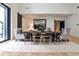 Bright dining area boasts a large modern table, stylish chairs, and expansive windows for natural light at 1572 Clifton Rdg, Atlanta, GA 30307
