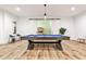 Basement game room featuring a pool table, modern lighting, and sleek dark trim at 1572 Clifton Rdg, Atlanta, GA 30307