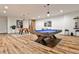A modern game room featuring a pool table and foosball table, perfect for entertaining guests at 1572 Clifton Rdg, Atlanta, GA 30307