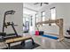 Home gym with a variety of exercise equipment and natural light at 1572 Clifton Rdg, Atlanta, GA 30307