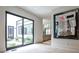 Bright hallway with a view to outdoor courtyard, showcasing modern art, and neutral decor at 1572 Clifton Rdg, Atlanta, GA 30307