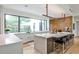 Modern kitchen featuring a center island with seating, stainless steel appliances, and large windows at 1572 Clifton Rdg, Atlanta, GA 30307