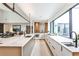 Open-concept kitchen featuring a large island, sleek countertops, and seamless flow into the dining area at 1572 Clifton Rdg, Atlanta, GA 30307