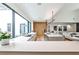 Open-concept kitchen featuring a large island, sleek countertops, and seamless flow into the living area at 1572 Clifton Rdg, Atlanta, GA 30307