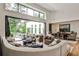 Inviting living room with high ceilings, a comfortable sectional sofa, and views of the backyard oasis at 1572 Clifton Rdg, Atlanta, GA 30307