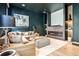 Cozy living room with dark green walls, fireplace, and recessed lighting perfect for entertaining or relaxing at 1572 Clifton Rdg, Atlanta, GA 30307