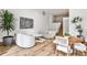 Bright open-concept living room with hardwood floors, modern furnishings, and a large window for natural light at 1572 Clifton Rdg, Atlanta, GA 30307