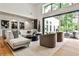 Bright living room featuring modern decor, a cozy seating area, and large sliding doors to the outside at 1572 Clifton Rdg, Atlanta, GA 30307