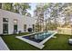 Modern pool is set against a backdrop of trees and the golf course at 1572 Clifton Rdg, Atlanta, GA 30307