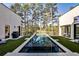 Backyard boasts a modern pool, sleek design, and ample space for outdoor entertaining at 1572 Clifton Rdg, Atlanta, GA 30307