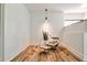 Comfortable sitting area with chair, ottoman, and plant creating a cozy and inviting space with natural light at 1572 Clifton Rdg, Atlanta, GA 30307