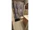 Bathroom with shower and tiled floor at 2860 Camelot Woods Dr, Lawrenceville, GA 30044
