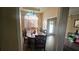 Elegant dining room with a large table, chandelier, and natural light at 2860 Camelot Woods Dr, Lawrenceville, GA 30044
