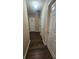 Hallway with hardwood flooring leading to multiple rooms at 2860 Camelot Woods Dr, Lawrenceville, GA 30044