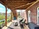 Relaxing backyard patio featuring wicker furniture, overhead string lights, and a serene outdoor space at 4071 Woodward Walk Ln, Suwanee, GA 30024