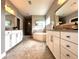 Bright bathroom featuring a soaking tub, dual vanities, large mirrors and a glass shower at 4071 Woodward Walk Ln, Suwanee, GA 30024