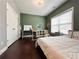 Cozy bedroom featuring a workspace, a large window, and light walls, creating a peaceful atmosphere at 4071 Woodward Walk Ln, Suwanee, GA 30024