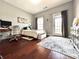Comfortable bedroom with a window and a dresser, offering a serene retreat with ample storage and natural light at 4071 Woodward Walk Ln, Suwanee, GA 30024