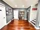 Bonus room featuring hardwood floors, storage cabinets, and easy access to the stairs at 4071 Woodward Walk Ln, Suwanee, GA 30024