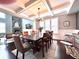 Dining area with hardwood floors and view of living room fireplace at 4071 Woodward Walk Ln, Suwanee, GA 30024