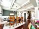 Dining room with hardwood floors, coffered ceilings and view of stairs at 4071 Woodward Walk Ln, Suwanee, GA 30024