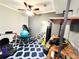 Home gym with exercise equipment, including a treadmill and weight bench, and a ceiling fan at 4071 Woodward Walk Ln, Suwanee, GA 30024