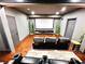 A cozy home theater featuring comfortable seating, a large projection screen, and dimmable lights at 4071 Woodward Walk Ln, Suwanee, GA 30024