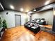 Home theater featuring leather recliners, wall sconces, and a projector screen for a cinematic experience at 4071 Woodward Walk Ln, Suwanee, GA 30024