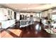 Large kitchen with white cabinets, granite countertops, stainless steel appliances, and a central island with bar seating at 4071 Woodward Walk Ln, Suwanee, GA 30024