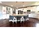 Spacious kitchen with white cabinetry, subway tile backsplash, stainless steel appliances, and a large island at 4071 Woodward Walk Ln, Suwanee, GA 30024