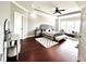 Large main bedroom featuring a trey ceiling, dark wood floors, a seating area and ensuite at 4071 Woodward Walk Ln, Suwanee, GA 30024