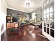 Home office featuring modern desk, ample shelving, a large window, and a stylish rug at 4071 Woodward Walk Ln, Suwanee, GA 30024