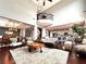 Open-concept living space with hardwood floors, dining room, kitchen, and living room at 4071 Woodward Walk Ln, Suwanee, GA 30024