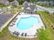 Community pool offers a refreshing escape with ample seating and a charming pool house, perfect for relaxation and social gatherings at 4071 Woodward Walk Ln, Suwanee, GA 30024