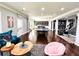 Large recreation area boasting hardwood flooring, a full wet bar, and comfortable seating at 4071 Woodward Walk Ln, Suwanee, GA 30024