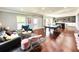 Spacious recreation room with a ping pong table, comfortable seating, and wet bar at 4071 Woodward Walk Ln, Suwanee, GA 30024