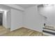 Unfurnished basement with wood flooring, white walls, and access to a staircase at 4576 Dorset Circle, Decatur, GA 30035