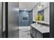 Beautiful bathroom featuring blue tiling and modern vanity with gold fixtures at 4576 Dorset Circle, Decatur, GA 30035