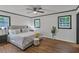 This bedroom features hardwood floors, two windows, and contrasting trim at 4576 Dorset Circle, Decatur, GA 30035