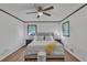 A bedroom features hardwood floors, two windows, dark trim and a ceiling fan at 4576 Dorset Circle, Decatur, GA 30035