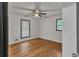 Bright bedroom with hardwood floors, ceiling fan, and two windows letting in natural light at 4576 Dorset Circle, Decatur, GA 30035