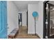 Bright entryway featuring hardwood floors, blue door, and decorative furnishings at 4576 Dorset Circle, Decatur, GA 30035